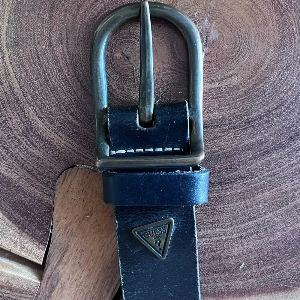 Guess 35” long, 1 1/4” wide, brown leather belt.